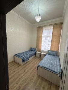 A bed or beds in a room at Хостел Мистер Шох