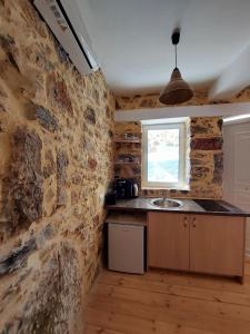 Kuchyň nebo kuchyňský kout v ubytování Roza Stone Studio & Suite