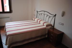 A bed or beds in a room at Apartamentos Moravella