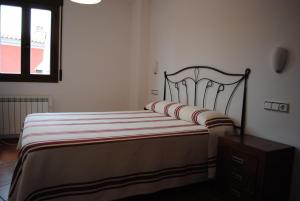 A bed or beds in a room at Apartamentos Moravella