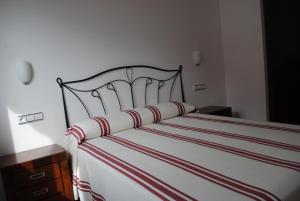 A bed or beds in a room at Apartamentos Moravella