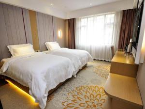 Katil atau katil-katil dalam bilik di Lavande Hotel Jinan Quancheng Road Baotu Spring Branch