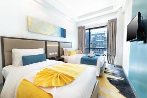 Ένα ή περισσότερα κρεβάτια σε δωμάτιο στο Savoy Hotel Mactan