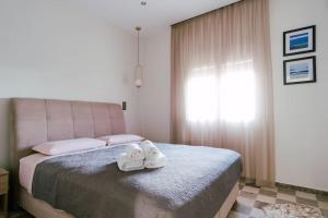 Postel nebo postele na pokoji v ubytování Sea La Vie