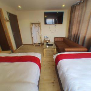 Letto o letti in una camera di Hotel Odaan
