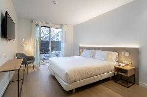 Un pat sau paturi într-o cameră la Hotel Trinkete