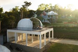 a house with a dome on top of a deck at Ozone by Bankhaokho in Ban Thung Samoe