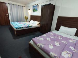 Postel nebo postele na pokoji v ubytování Haven Eleven Homestay