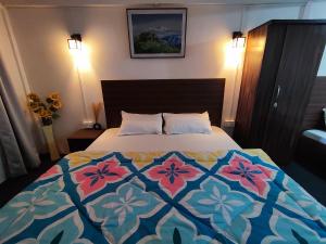Postel nebo postele na pokoji v ubytování Haven Eleven Homestay