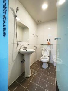 a bathroom with a toilet and a sink at 24 Guesthouse Sinchon Avenue in Seoul