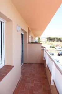 a hallway with a tile floor and a window at Residencial Super Stop Apartaments Torre Valentina in Sant Antoni de Calonge