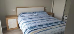 Ένα ή περισσότερα κρεβάτια σε δωμάτιο στο Apartamento camiño dos Faros