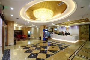 a lobby of a hotel with a checkered floor at Pai Hotel Dujiang Yanxujia Gaoqiao in Dujiangyan