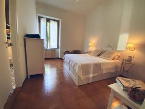 מיטה או מיטות בחדר ב-A Casa di Gemma - Affitti Brevi Italia
