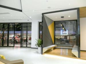 a lobby of a store with a bench in a building at IU Hotels·Nanning Zoo Metro Station RT-Mart in Nanning