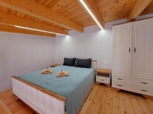 Postel nebo postele na pokoji v ubytování Roza Stone Studio & Suite