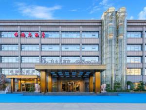 a rendering of a large building at Magnotel Business Jinan Zoo Wuyingshan North Road Flagship Hotel in Beiyuan