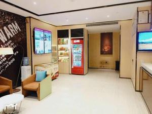a store with a coca cola soda machine in a room at IU Hotel Binzhou University in Binzhou