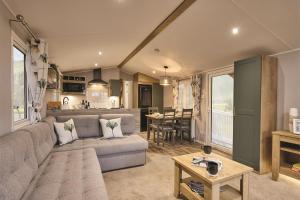 a living room with a couch and a table at Seaton Estate in Arbroath