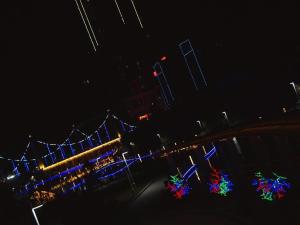 a night view of a carnival with colorful lights at James Joyce Coffetel·Hotan Chuanyi Kaixuan in Hoten
