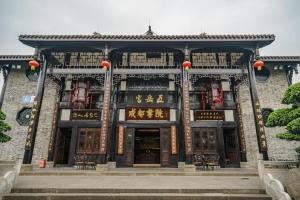 a building with a gate in front of it at James Joyce Coffetel·Chengdu Chunxi in Chengdu