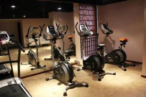 a gym with a bunch of exercise bikes in a room at YONG JING VILLA in Xuejiawan