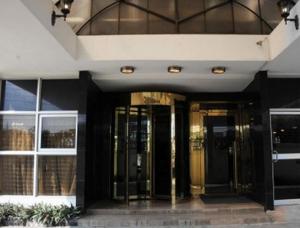 a building with two revolving doors on it at Rachael Hotel in Port Harcourt