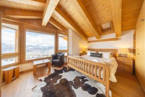Ένα ή περισσότερα κρεβάτια σε δωμάτιο στο Chalet Enchanteur