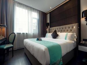 Lova arba lovos apgyvendinimo įstaigoje Xana Hotelle·Lianyungang Donghai
