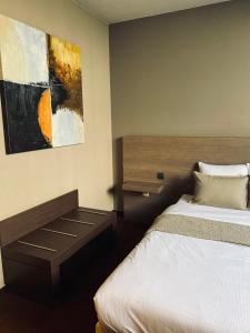 Postel nebo postele na pokoji v ubytování HOTEL BORNEM