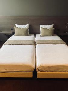 Postel nebo postele na pokoji v ubytování HOTEL BORNEM