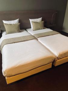 Postel nebo postele na pokoji v ubytování HOTEL BORNEM