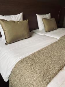 Postel nebo postele na pokoji v ubytování HOTEL BORNEM