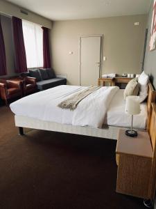 Postel nebo postele na pokoji v ubytování HOTEL BORNEM