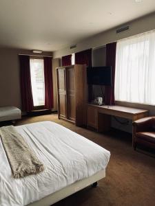 Postel nebo postele na pokoji v ubytování HOTEL BORNEM