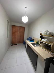 a kitchen with a sink and a counter top at Bale de Barbara in Pampang