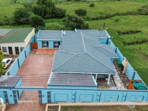 an overhead view of a blue house with solar panels at Elam Guest House in Mthatha