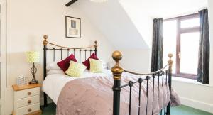 A bed or beds in a room at Rooms by Maes y mor 