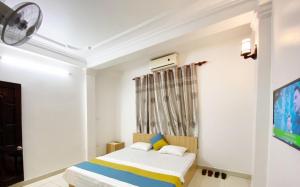 Postel nebo postele na pokoji v ubytování Bích Ngọc Hotel Hà Nội