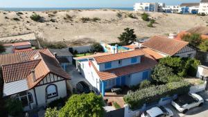 an aerial view of a house with orange roofs at Villa 16 personnes à 50m plage Sud in Lacanau