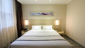 Postel nebo postele na pokoji v ubytování City Comfort Inn Chenzhou Dongjianghu