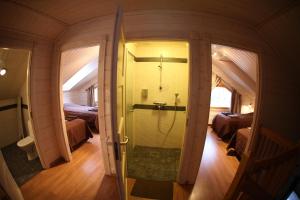 a small bathroom with a shower in a room at Saimaa Lakeside in Ruokolahti