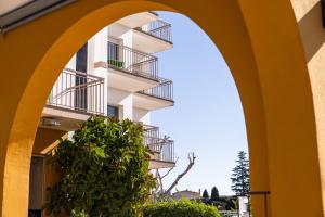 a building with a green plant in front of it at RVHotels GR92 in Torroella de Montgrí