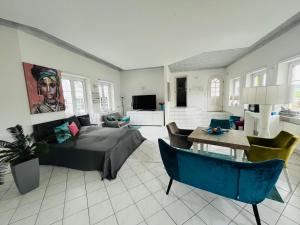 a living room with a couch and a table at Haus Rehlein in Pleiskirchen