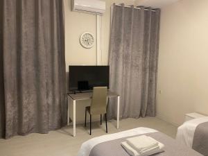 TV o dispositivi per l'intrattenimento presso Cultural Crossing Hotel
