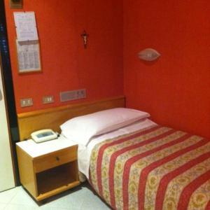 Postel nebo postele na pokoji v ubytování Hotel Junior