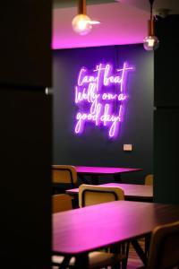 a neon sign that says cant wait waking up for a good day at Haka House Wellington in Wellington +27 photos