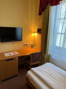 Sjónvarps- og/eða afþreyingartæki á Workers Castle Apartments für die besten Monteure