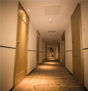 a hallway of an office building with a long corridor at City Comfort Inn Luoyang Lijingmen Metro Station in Luoyang