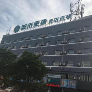 a large gray building with chairs on top of it at City Comfort Inn Ganzhou Railway Station in Ganzhou